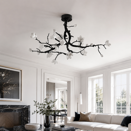 Arborielle copper branch ceiling light in a white living room with a black marble fireplace
