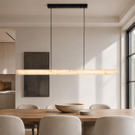 Nevella alabaster LED pendant light centered above a long dining table