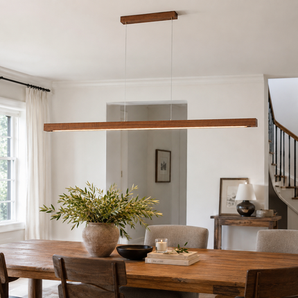 Alderline wood linear light above a rustic rectangular dining table