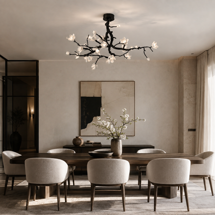 Illuminated Arborielle branch ceiling light above a modern dining table