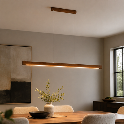 Alderline wood LED pendant above a minimalist dining table with warm downward light