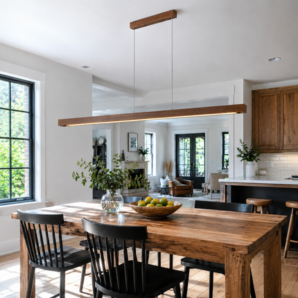 Long Alderline wood pendant light suspended above a large open-plan dining table