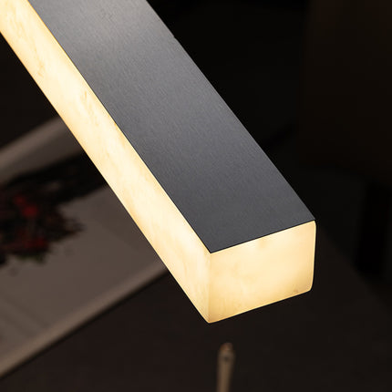 Close-up of Nevella snowflake alabaster linear pendant light with black metal upper frame