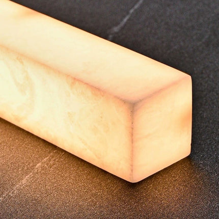 Close-up of the illuminated snowflake alabaster corner on the Nevella pendant light