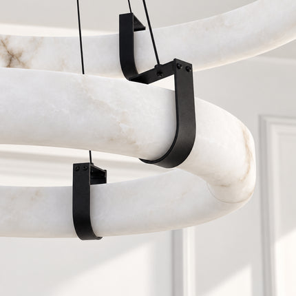 Close-up of natural alabaster and black iron suspension brackets