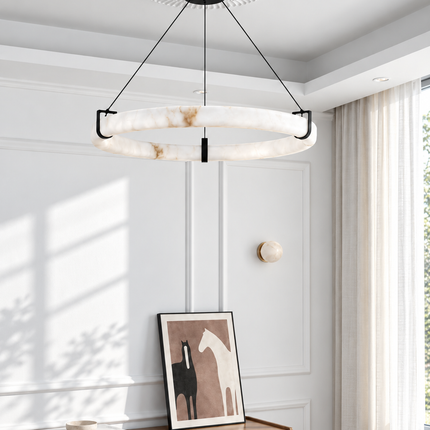 Anulora alabaster chandelier in a bright paneled interior above a wood cabinet