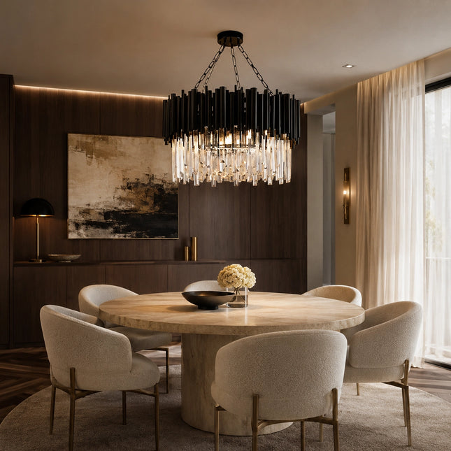 Arcelle black metal crystal chandelier over a round dining table with warm crystal lighting