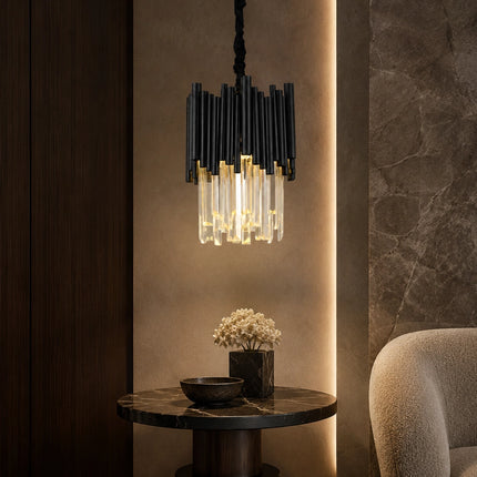 Arcelle black metal crystal pendant light above a small accent table with warm crystal lighting