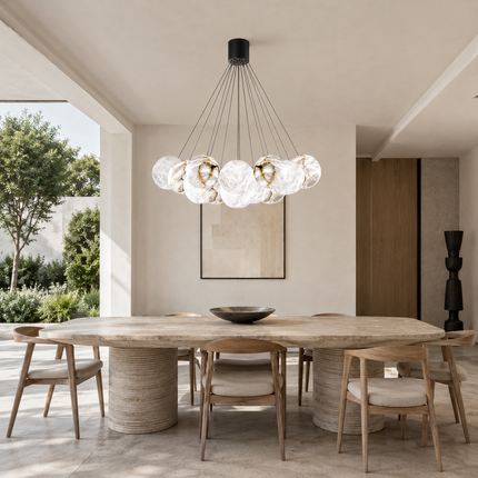 Alabaster bubble chandelier above a large dining table in a neutral interior
