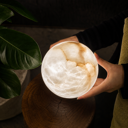 Natural alabaster globe detail for the Avelune Bubble Alabaster Chandelier, showing unique veining and translucent texture
