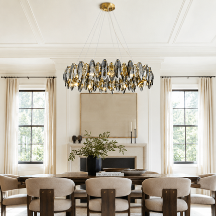 Navette smoke gray crystal chandelier centered above a long formal dining table