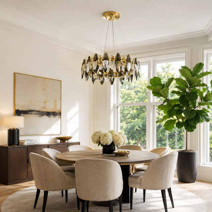 Navette smoke gray crystal chandelier above a round dining table beside large windows