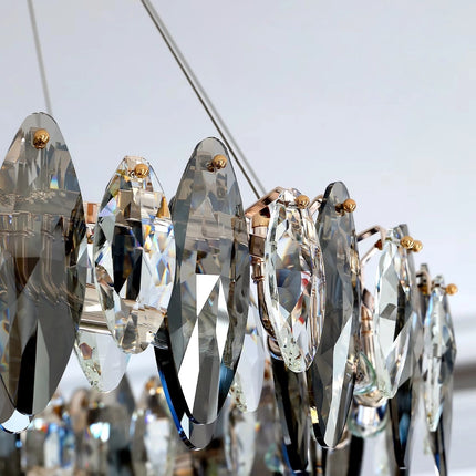 Side detail of layered smoke gray and clear crystals on the Navette chandelier