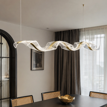 Tidal Ribbon linear chandelier above a contemporary dining table