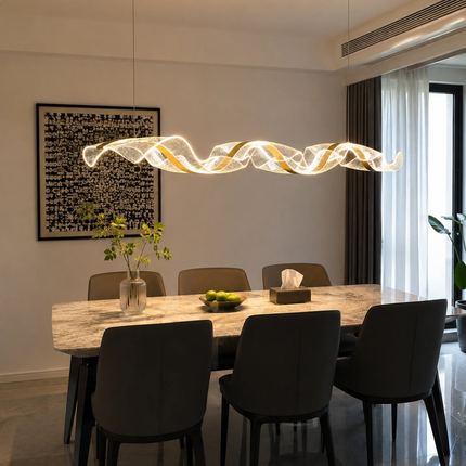 Illuminated acrylic wave chandelier above a rectangular marble dining table