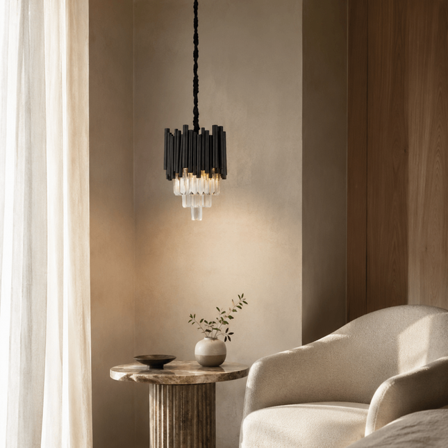 Virelle black metal crystal pendant light above a round accent table in a warm neutral bedroom corner