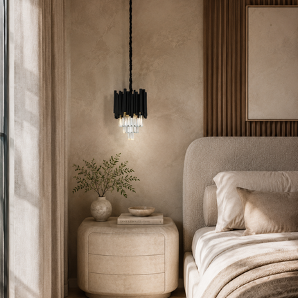 Virelle black metal crystal pendant light above a rounded nightstand beside an upholstered bed